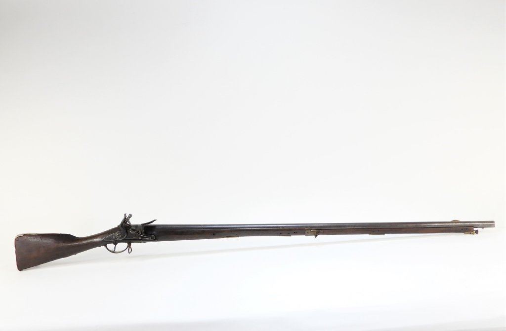 Early 20th century South Carolina marked Dutch musket, .78 bore, 61 ¼ inches long, having a walnut stock, brass butt plate, a trigger guard marked "S. ROLFE SC," ($8,610).